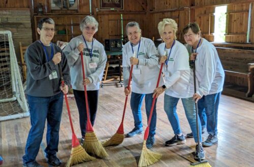 Alumnae are sweeping the Wigwam during Service Learning Weekend.