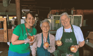 Alex, Wyeth, and Karen prep food for Service Weekend 2025.