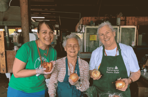 Alex, Wyeth, and Karen prep food for Service Weekend 2025.