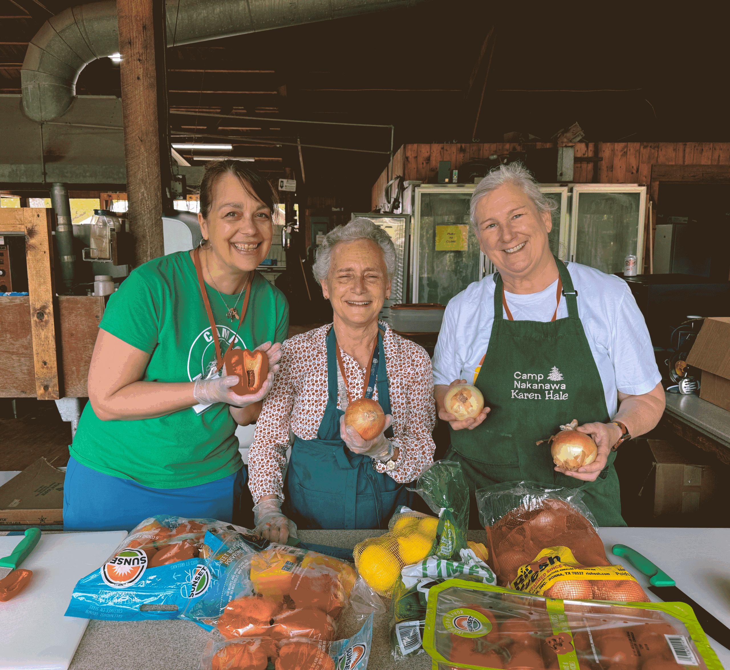 Alex, Wyeth, and Karen prep food for Service Weekend 2025.